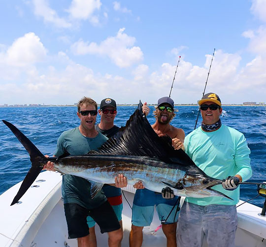 Anglers with their trophy fish